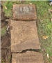 Photo of broken headstone that was buried under sod - Youngs Cemetery