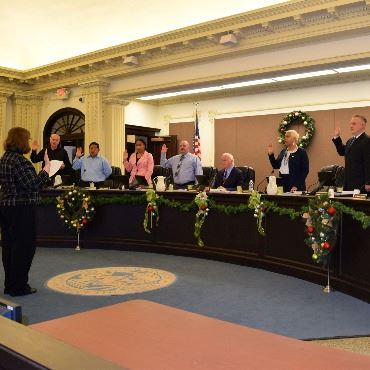 City Clerk Victoria Houser administers the oath of office to all of the 2022-2024 City Commissioners