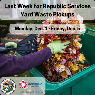 A photo of a neighbor putting a pile of leaves into a yard waste bin, with a rake and gloves.